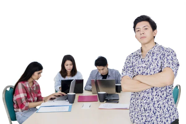 Male confident entrepreneur with his team on studio — Stock Photo, Image