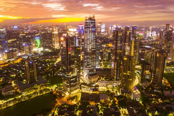 Beautiful glowing skyscrapers at dramatic sunset — Stock Photo, Image