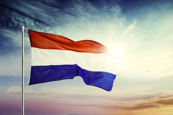 Netherlands national flag waving at sunrise time — Stock Photo, Image