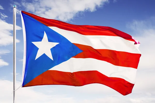 Puerto Rico flag fluttering under blue sky — Stock Photo, Image