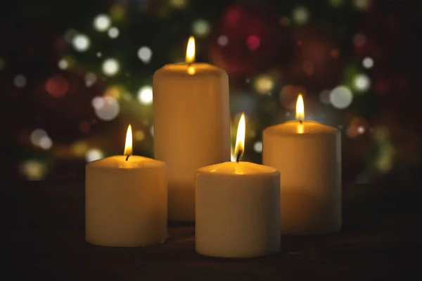 Christmas candles with blurred twinkling light — Stock Photo, Image