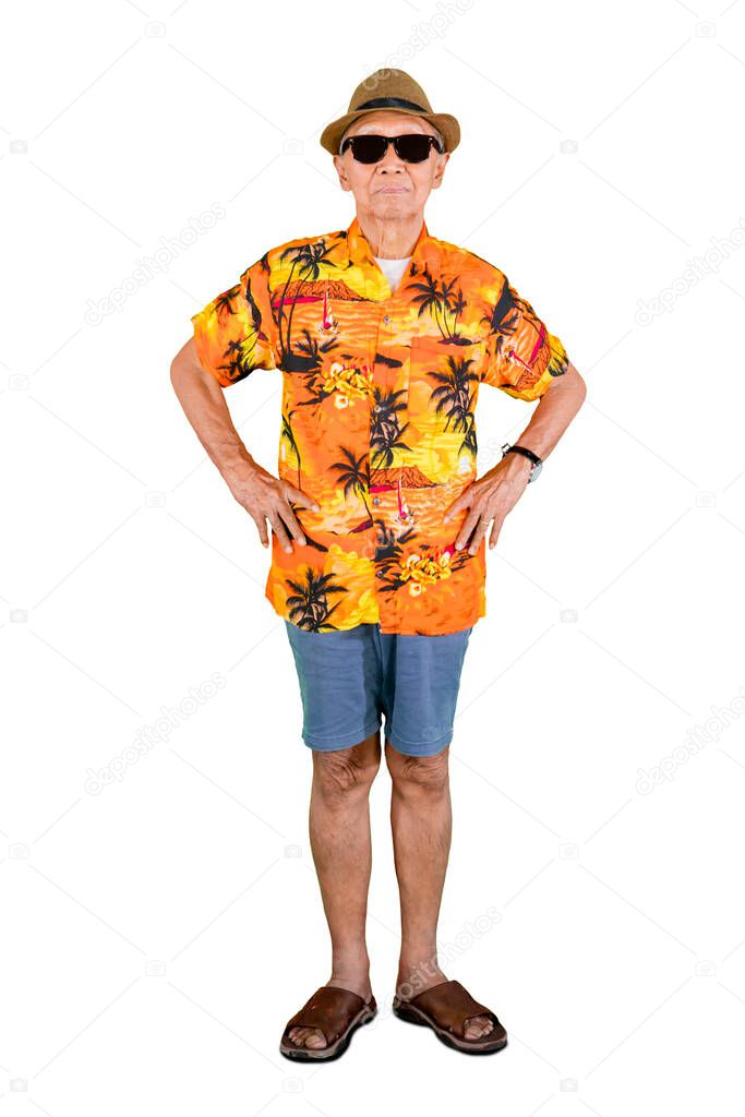 Full length of old man wearing sunglasses and summer clothes while standing in the studio, isolated on white background