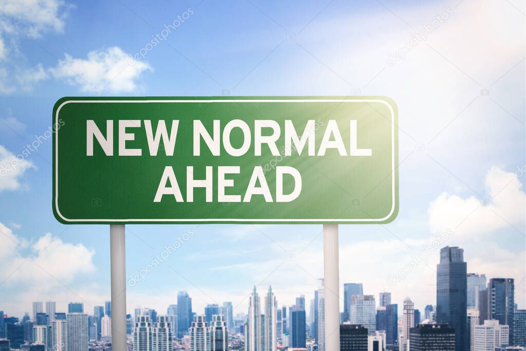 Signpost with New Normal Ahead text and modern city background