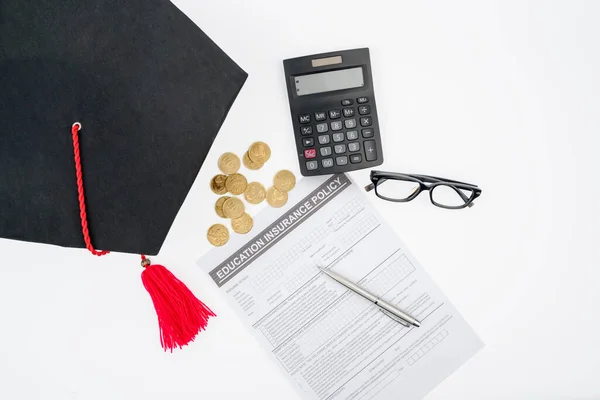 Top View Education Insurance Policy Coins Graduation Hat Calculator Table — Stock Photo, Image