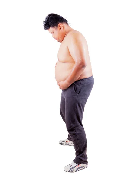 Plná Délka Mladého Muže Drží Své Tlusté Břicho Zatímco Stojí — Stock fotografie