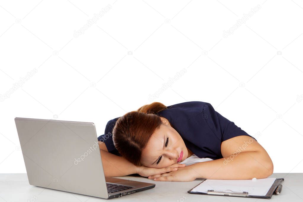 Overweight businesswoman sleeping in the studio while working with a computer and paperwork on the desk. Isolated on white background