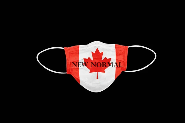 新的普通文字的面具与加拿大国旗 隔离在黑色背景 加拿大的Coronavirus病或Covid 19的象征 — 图库照片