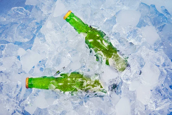 Top View Two Unopened Bottles Fresh Beer Stack Ice Cubes — Stock Photo, Image