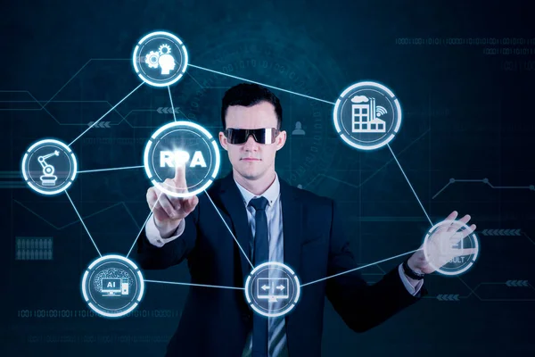 Male Executive Wearing Futuristic Glasses While Touching Rpa Button Virtual — Stock Photo, Image