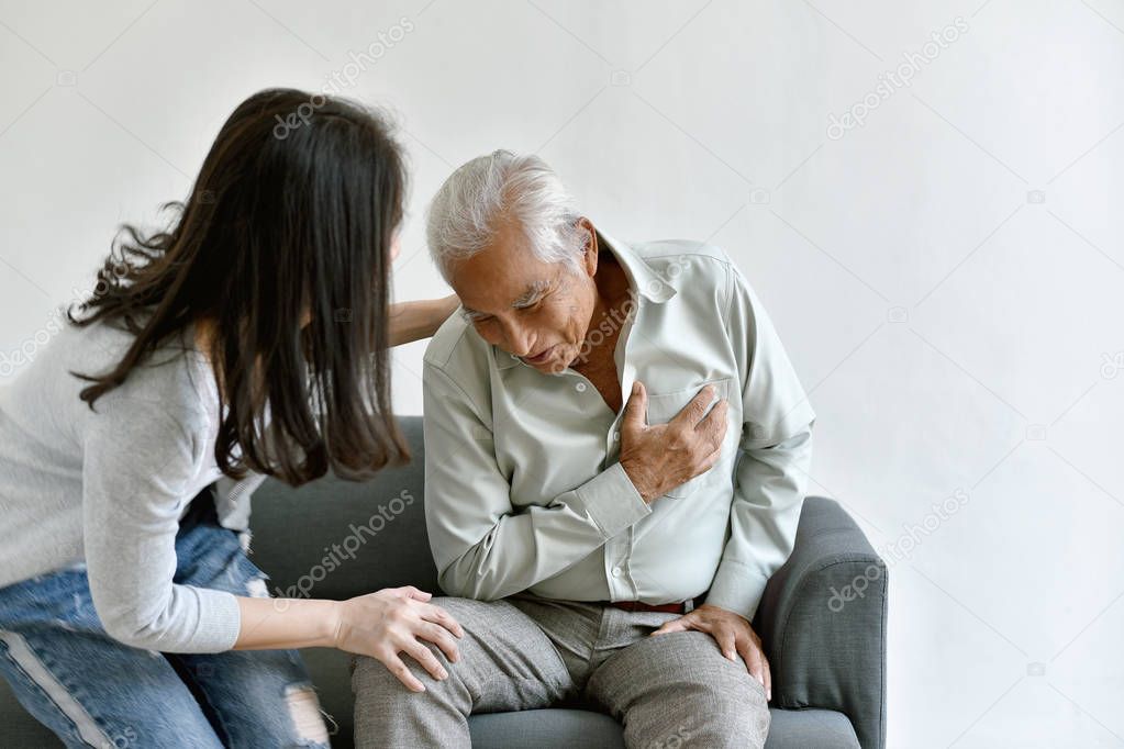 Heart attack disease problem in old man, Elderly asian man with hand on chest gesture, Daughter frighten and worry about her father chest pain symptom, Senior healthcare insurance concept.