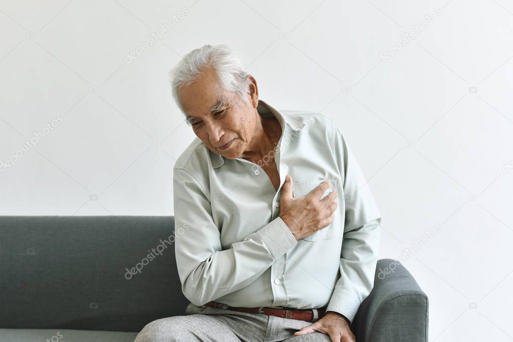 Heart attack disease problem in old man, Elderly asian man with hand on chest gesture, Senior healthcare insurance concept.