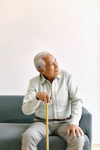 Confusing and forgetful elderly asian man with thinking gesture, Alzheimer\'s disease, Dementia cognitive brain problem in old pensioner, Senior healthcare concept.