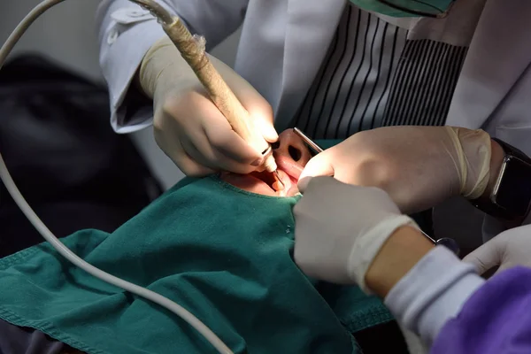 Dental care check up, Dentist examining and doing teeth treatment in dental clinic, Yearly visit for teeth cleaning and scaling to prevent gum disease problems, Healthy oral hygienic.