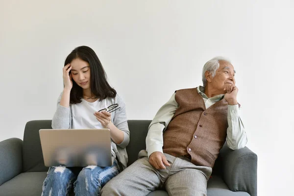 Social isolation problem in retiree citizen, Asian daughter focus on hard working and ignore loneliness elderly old father, Family relationship conflict, Senior mental health problem concept.