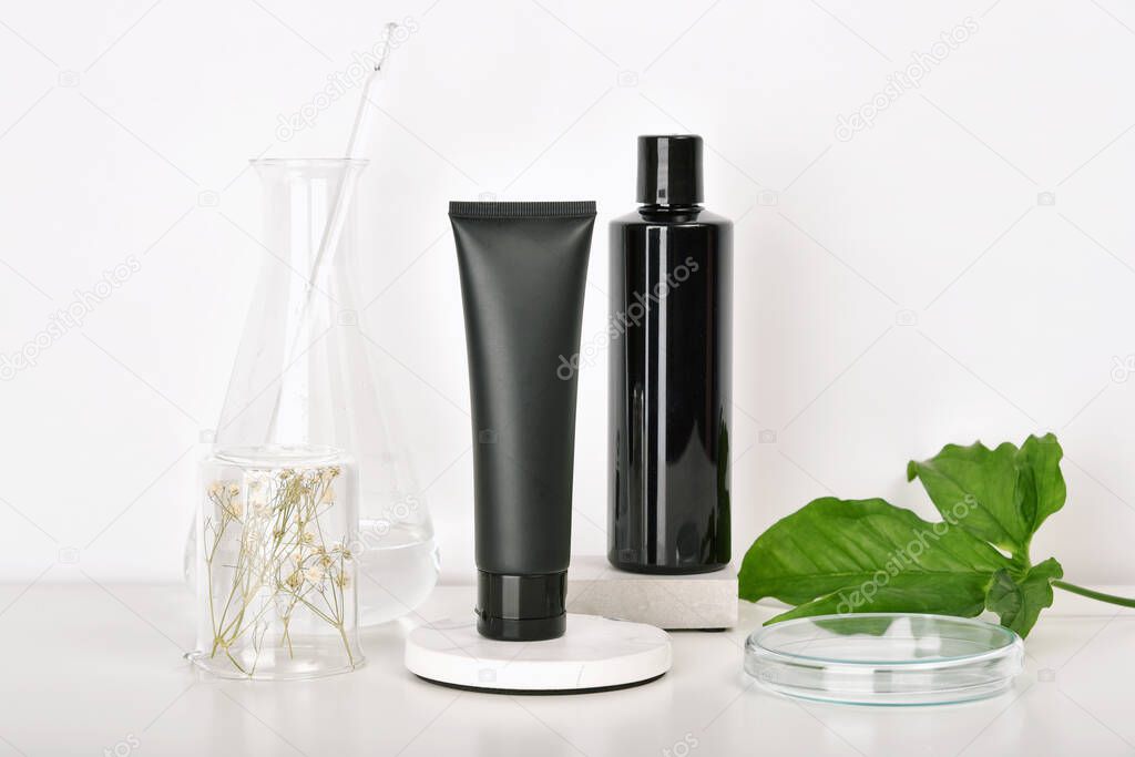 Natural skincare beauty products researching lab, Natural organic botany extraction and scientific laboratory glassware, Blank label cosmetic container for branding mock-up.