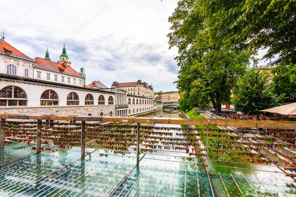 Bridge in Ljubljana city, with locks as symbol of love. Romantic tradition in Slovenia capital