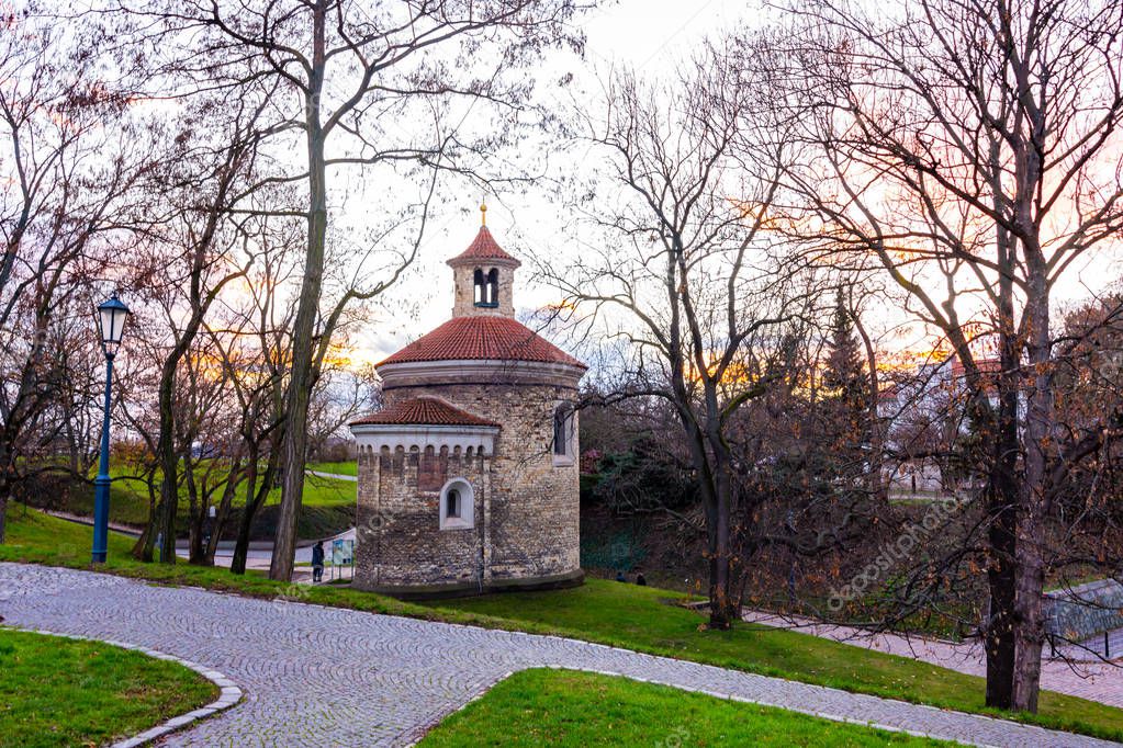 Prague, Czech republic: Panorama of Vysehrad basilica during the sunset. Orange clouds above the ancient church in czech capital.