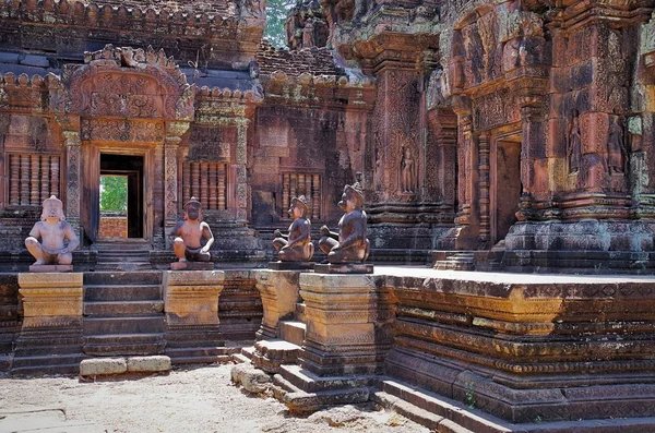 Monkey guardians at entrance to a sanctuary. Banteay Srei - pink temple, citadel of the women, or citadel of beauty. Is built of red sandstone and dedicated to the Hindu god Shiva. Angkor - UNESCO World Heritage site. Cambodia, Siem Reap