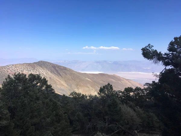 California landscapes nature background. Slowly filling clouds in the mountains. Fog