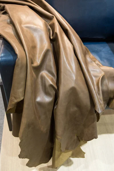 Cow hide leather tan background in the store.