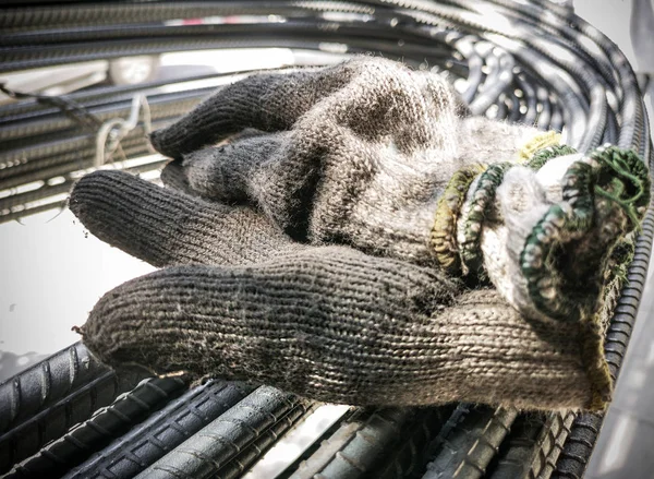 Old glove on steel bar