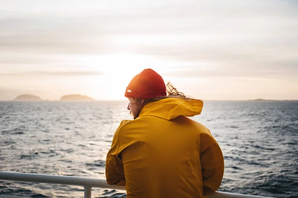 Hipster Traveler Wearing Red Hat Yellow Raincoat Looking Away Cloudy — Stock Photo, Image