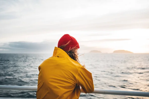 Hipster Traveler Wearing Red Hat Yellow Raincoat Looking Away Cloudy — Stock Photo, Image