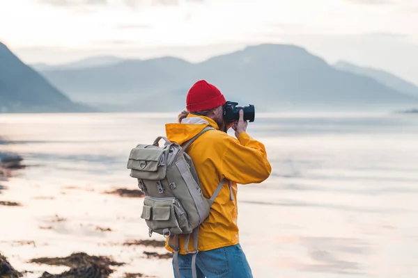 Hipster Traveler Photographer Takes Photo Beautiful Nordic Landscape Professional Camera — Stock Photo, Image