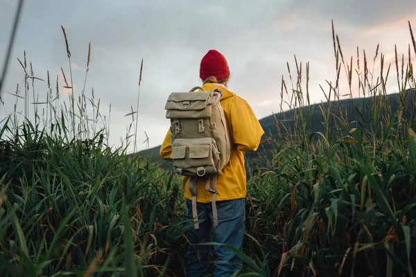 Hipster Traveler Wearing Backpack Yellow Raincoat Looking Away Mountain Alone — Stock Photo, Image
