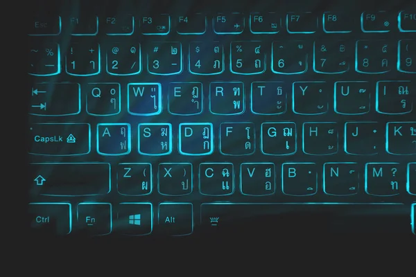 Keyboard gamer,blue light, black background,Used in cutting graphics.