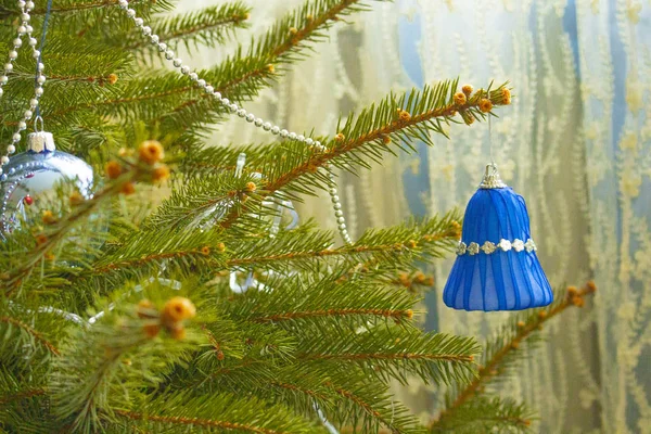 Christmas toy blue bell hanging on the tree