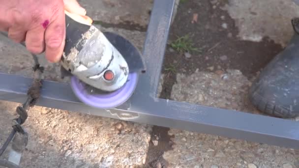 Hands of a man working with a grinder — Stock Video