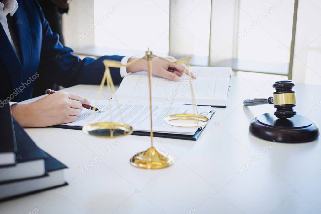 Teamwork of business lawyer colleagues, consultation and conference of professional female lawyers working having at law firm in office. Concepts of law, Judge gavel with scales of justice.