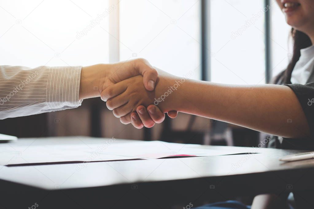 Meeting and greeting concept, Two confident Business handshake and business people after discussing good deal of Trading contract and new projects for both companies.