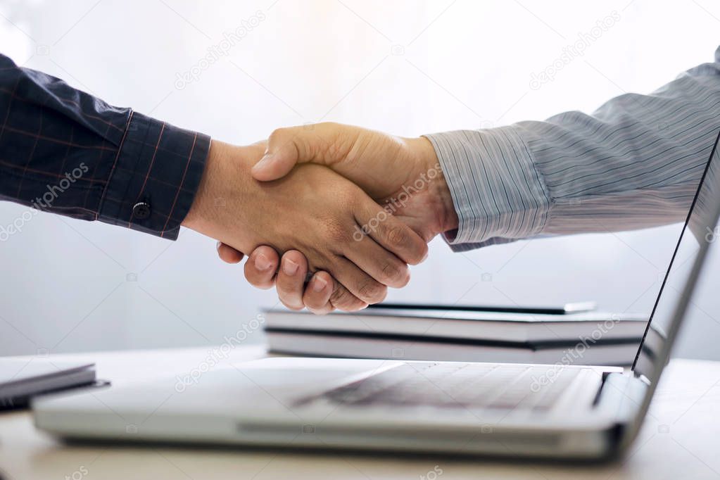 Business partnership meeting concept, Two confident Business handshake and business people after discussing good deal of Trading contract and new projects for both companies, success, partnership.