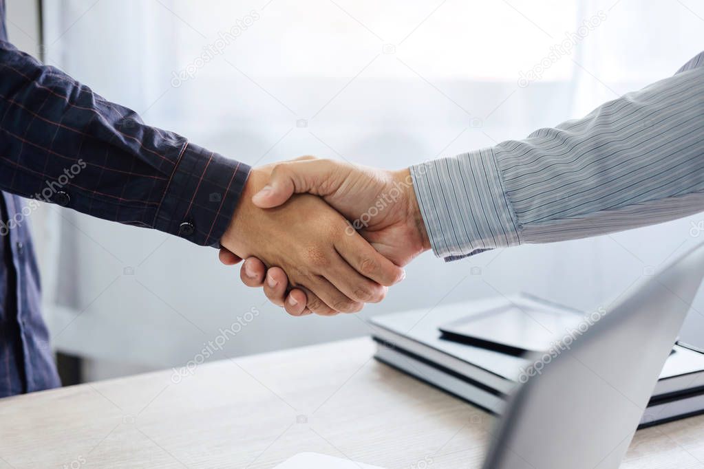Business partnership meeting concept, Two confident Business handshake and business people after discussing good deal of Trading contract and new projects for both companies, success, partnership.
