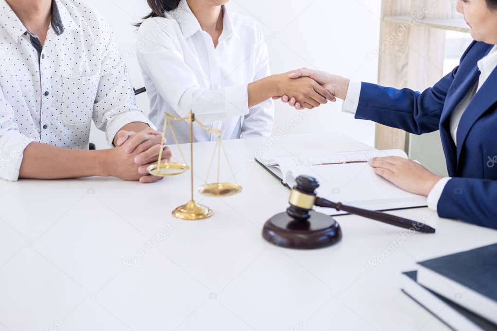 Handshake after good cooperation greeting, Having meeting with team at law firm, Consultation between a female lawyer and businesswoman customer, tax and the company of real estate concept.