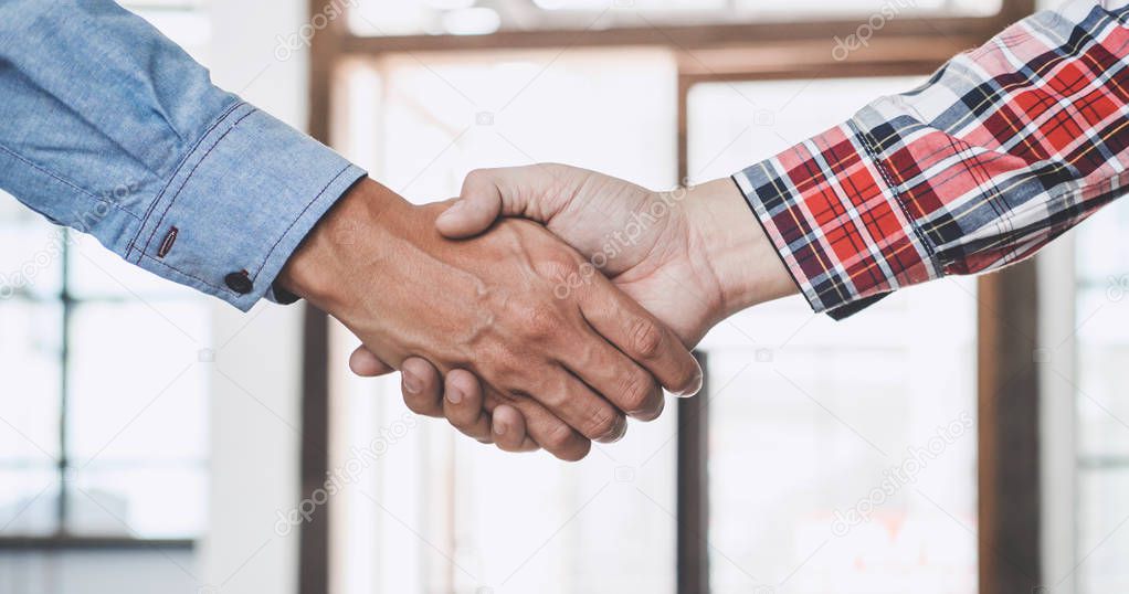 Teamwork of business partnership Handshaking after good cooperation, Consultation between businessman and customer, Trading contract and new projects for the company, Meeting and greeting concept.
