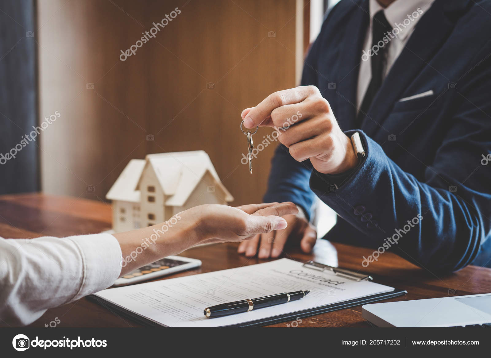 Real Estate Agent Sales Manager Holding Filing Keys Customer