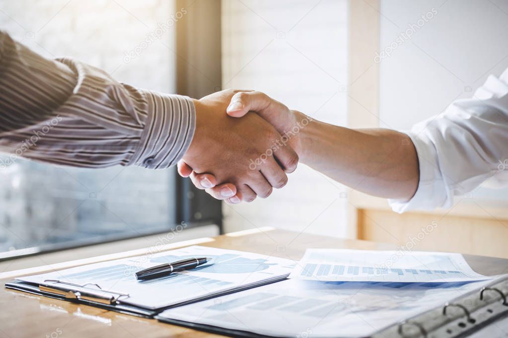 Successful of businessmen handshaking and business people after discussing good deal of trading contract, Business partnership meeting and greeting concept.