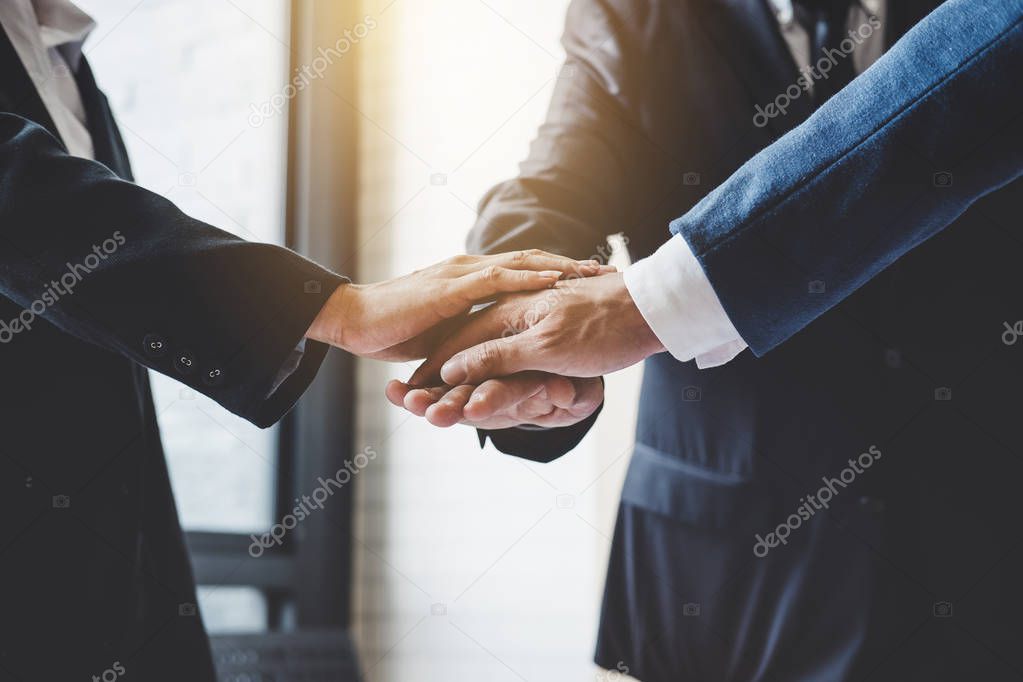 Image of business people joining and putting hands together during their meeting, connection and collaboration concept, Teamwork process of partner and best relationship.