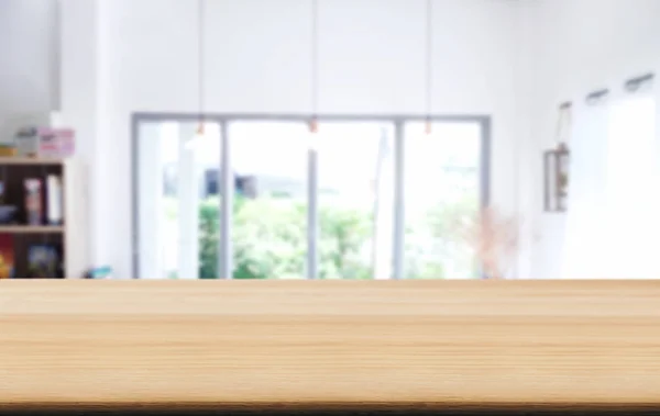 Empty wooden table and blurred background of abstract in front of coffee shop or restaurant for display of product or for montage.