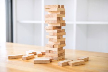 Wood block on the tower, Alternative risk concept, plan and strategy in business, Risk To Make Business Growth Concept With Wooden Blocks. clipart