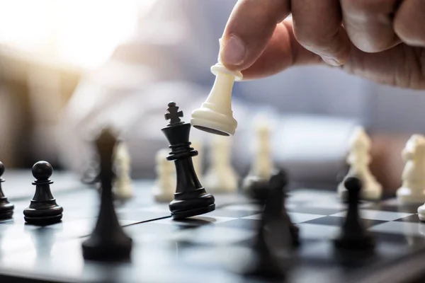 Businessman`s Hand Playing Chess Game To Development Analysis Ne Stock  Photo - Image of competition, business: 123928716