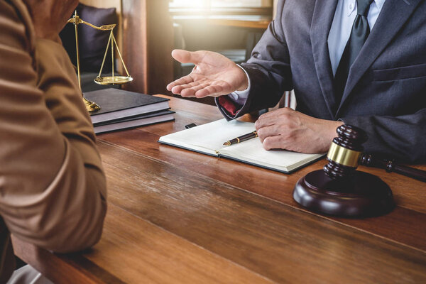 Customer service good cooperation, Consultation between counselor or male lawyer and businesswoman customer, tax and the company of real estate concept.