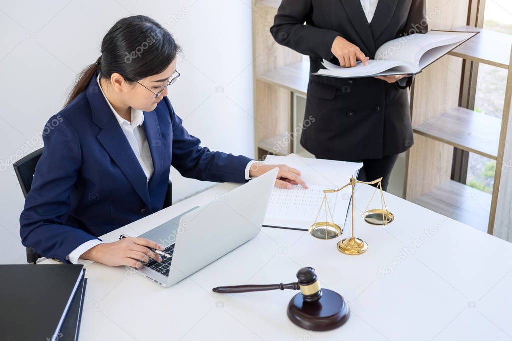 Teamwork of business lawyer colleagues, consultation and conference of professional female lawyers working having at law firm in office. Concepts of law, Judge gavel with scales of justice.