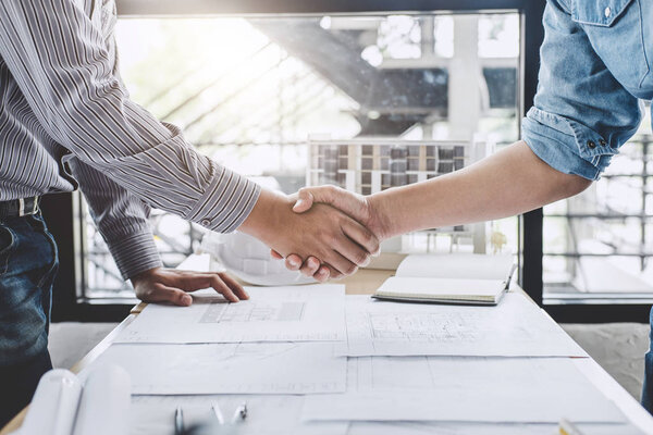 Meeting and greeting, Two engineer or architect meeting for project, handshake after consultation and conference new project plan, contract for both companies, success, partnership.