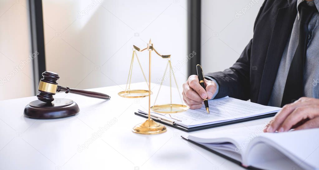 Judge gavel with Justice lawyers, Businessman in suit or lawyer working on a documents. Legal law, advice and justice concept.