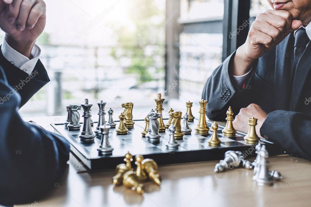 Two businessman playing chess game to plan strategy for success, thinking for planning overcoming difficulty and achieving goals business strategy for win.