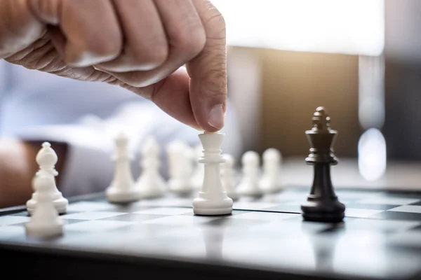 Businessman`s Hand Playing Chess Game To Development Analysis Ne Stock  Photo - Image of competition, business: 123928716